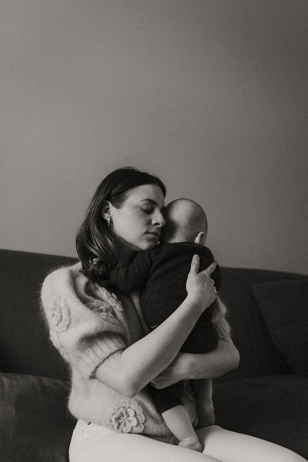 mum holding her son during a documentary family session in London